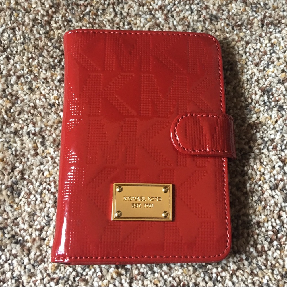 Brand new Michael Kors patent red leather wallet.